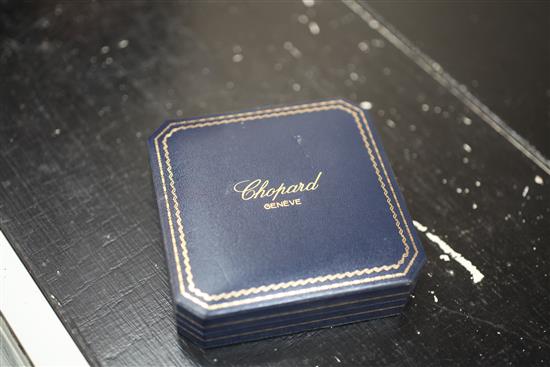 A Chopard Happy Diamond glass-panelled cross pendant,